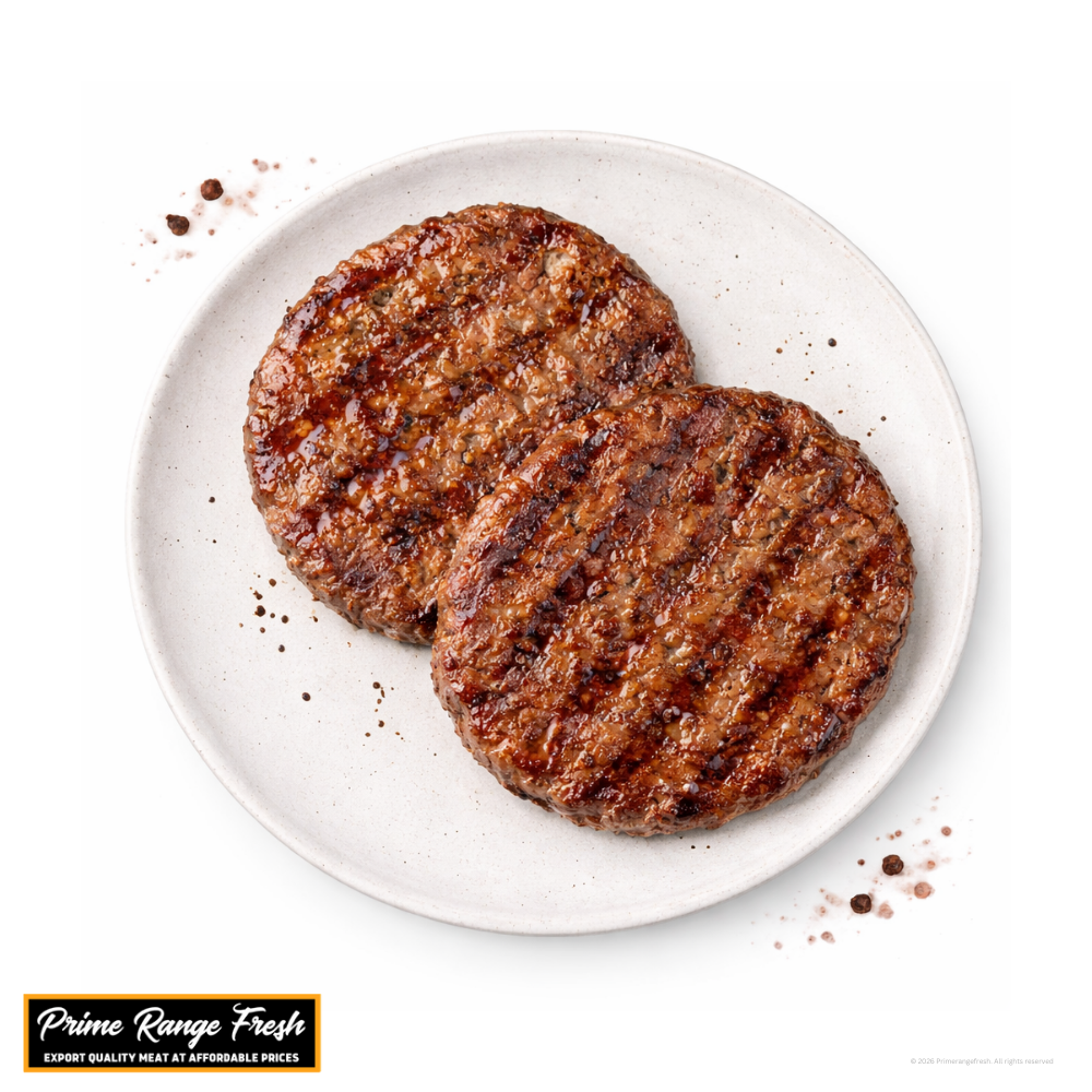 Two grilled hamburger patties on a white plate with 'Prime Range Fresh' branding.